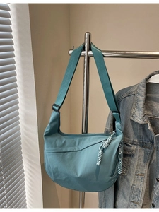 Blue nylon crossbody crescent bag with adjustable wide strap for casual daily use