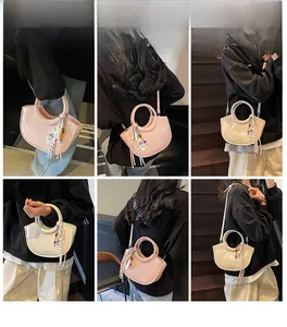 Lifestyle shots showing pink and beige crossbody bucket bags with beaded bag charms