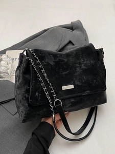 Classic black textured messenger bag with silver metal logo and chain shoulder strap