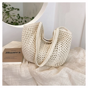 Detail shot of the cream crochet hollow-out tote bag weave texture on linen fabric
