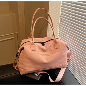 Close-up of light pink tote bag with matte texture, dual handles and NINGJIA logo detail