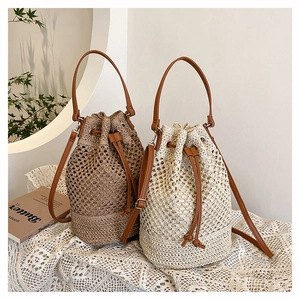 Detail of woven straw bucket bags with leather drawstring and textured crochet patterns