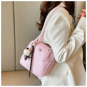 Pink rectangular shoulder bag with cute white ice cream pendant and gold logo detail