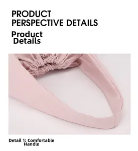 Detail of comfortable wide shoulder strap on pink nylon tote with ruched edge