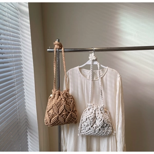 Close-up of bohemian woven drawstring bucket bags featuring intricate geometric patterns