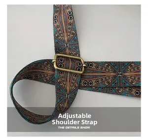 Detail of adjustable bohemian pattern shoulder strap with glossy gold buckle