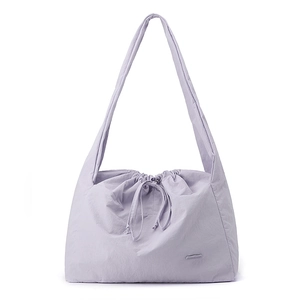 Detail of light purple waterproof nylon tote with drawstring closure and soft texture