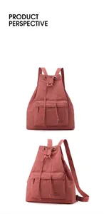 Front and side perspective of a soft coral pink nylon drawstring backpack with front pocket