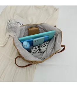 Spacious interior of woven tote bag with tablet, phone, and wallet for daily storage