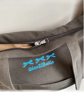 Detail showing the smooth metal zipper and inner lining of the canvas tote bag