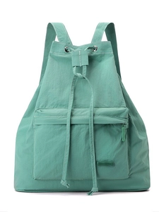 Minimalist light green drawstring backpack with zip pocket and durable nylon texture