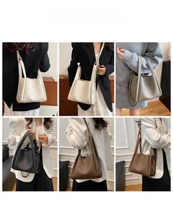 Detailed views of multi-color lychee pattern bucket bags shown with model styling
