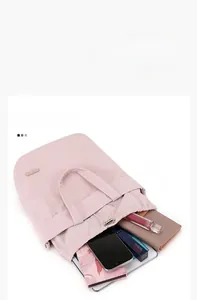 Detailed top view of pink nylon drawstring bag showing large storage capacity for items