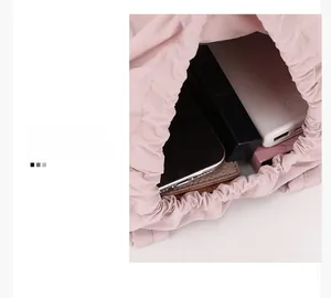 Internal capacity of pink nylon drawstring bag showing phone and wallet storage
