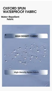 Close-up of blue water-repellent high-density nylon fabric with beads of water