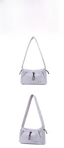 Close-up of light purple nylon shoulder bag showing pleated texture and drawstring detail