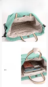 Internal capacity detail of mint green backpack showing zipper pocket and spacious interior