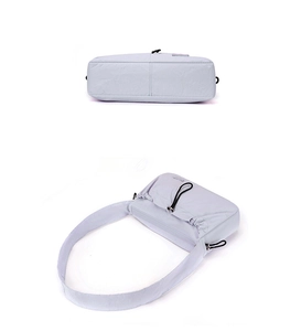 Detail view of light purple nylon shoulder bag with zip closure and adjustable wide strap