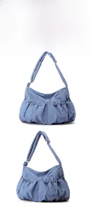 Detail view of the pleated nylon texture and adjustable drawstring on this lilac puffy bag