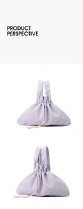 Detail of light purple waterproof nylon handbag showing drawstrings and side perspective
