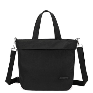 Close-up of waterproof nylon crossbody bag with adjustable strap and brand logo