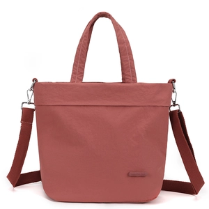 Close-up of durable nylon texture and adjustable shoulder strap with silver metal hooks