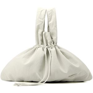 Detail of water-resistant nylon handbag with drawstring closure and brand logo
