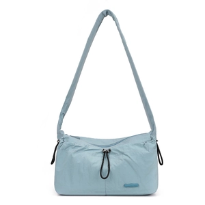 Detail of light blue nylon pleated cloud bag with adjustable drawstring and wide shoulder strap