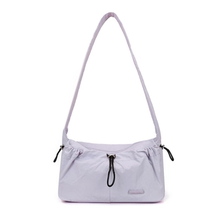 Detail view of lavender nylon shoulder bag featuring drawstring design and rubber logo