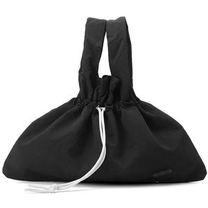 Detail view of black nylon drawstring handbag with contrasting white cord and dual handles