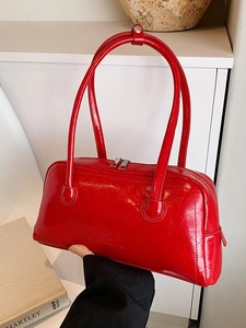 Chic red patent leather rectangular shoulder bag with dual metal zippers and handles