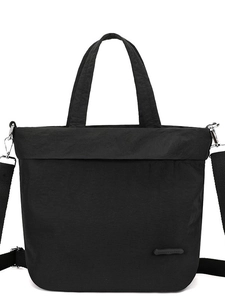 Minimalist black nylon drawstring crossbody bag with detachable strap and logo detail