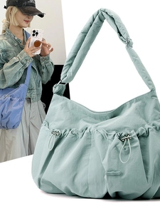 Minimalist pleated nylon crossbody bag with drawstring design and adjustable shoulder strap