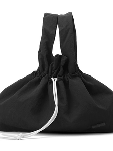Waterproof black nylon handbag with stylish drawstring closure and minimalist wave design