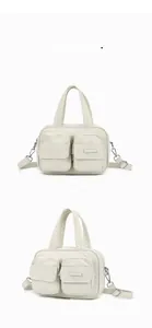 Detail view showing front and side angles of off-white multi-pocket nylon crossbody handbag