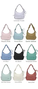 Detail view of nylon drawstring hobo bag in ten trendy colors with ruched shoulder strap