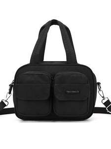 Black nylon crossbody bag with dual front utility pockets and adjustable shoulder strap