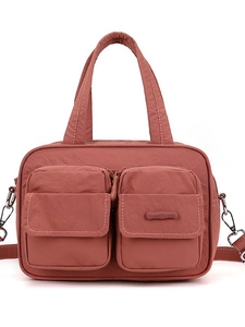 Mauve nylon multi-pocket cargo shoulder bag with top handles and adjustable strap