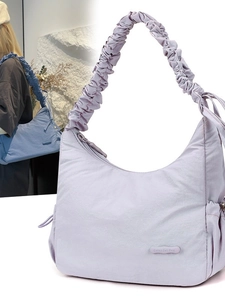 Chic lavender nylon crossbody bag with drawstring pockets and ruched cloud handle