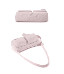 Detailed bottom and full view of a light pink nylon multi-pocket crossbody bag