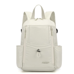 Front view of beige nylon backpack showing multi-pocket structure and durable fabric