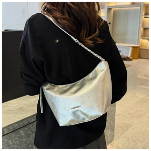 Silver metallic crescent hobo bag featuring fine pleated texture and logo detail