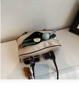 Interior view showing large capacity of the retro Boston bag with daily essentials