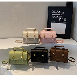 Detailed collection of five stylish leather messenger bags in ivory, pink, green, black and brown