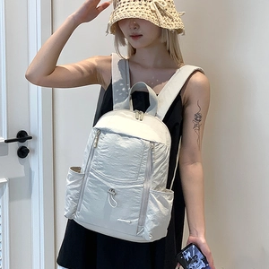 Close-up of lightweight water-resistant nylon backpack with multi-pocket design