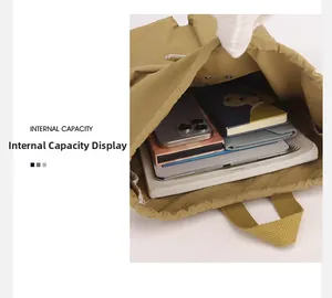 Internal capacity of the khaki nylon backpack showing space for tablet and notebook