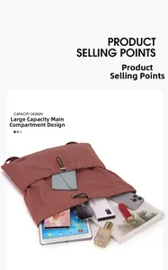 Flat lay showing large capacity interior of brick red drawstring backpack with daily essentials