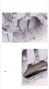Internal view of lilac pleated bucket bag showing capacity for wallet and phone