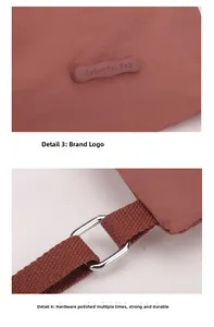 Detail of the rubberized logo and polished metal buckle on a red nylon backpack