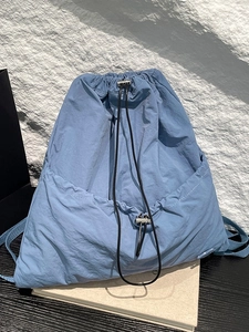 Minimalist blue drawstring backpack made of waterproof nylon for daily leisure or sports